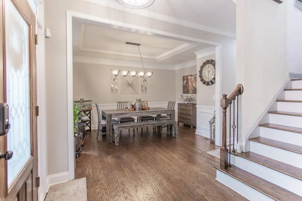 Vaulted living room with stone fireplace at the Roswell townhome